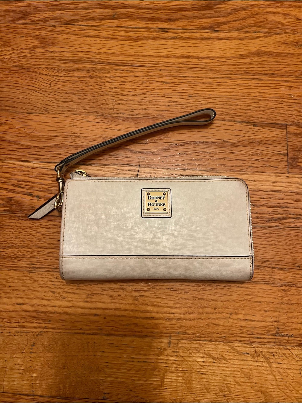 Dooney & Bourke Cream Wristlet Clutch with Gold Plaque